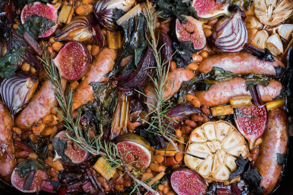 Autumnal outdoor cooking recipe: sausage, fig, honey and bean traybake.